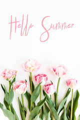  Hello summer text, pink tulips on white background. Minimal floral concept greeting card. Flat lay, top view.