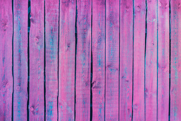 Wood texture. Holographic neon colors. Close-up of a wooden fence. Texture aquamarine pattern. Wood neon background. Fantasy wallpaper.