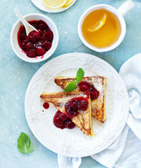 French toast with cherry sauce.
