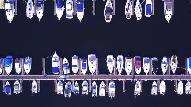 Yacht parking. Yacht and sailboat is moored at the quay, Aerial view of sailing yachts and boats near wooden piers.