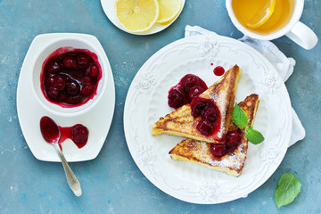 French toast with cherry sauce.