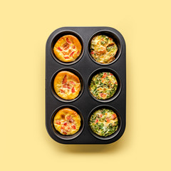 Healthy breakfast egg muffins with cheese, tomato and green veggetable, easy and healthy food concept