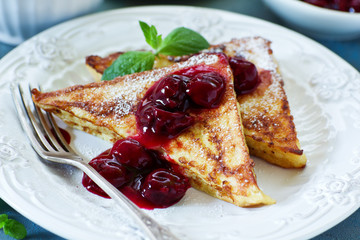 French toast with cherry sauce.