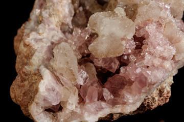 Macro mineral stone Pink Amethyst on a black background