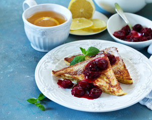 French toast with cherry sauce.