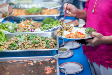 Food Buffet Catering Dining Eating Party Sharing Concept.people group catering buffet food indoor in luxury restaurant with meat colorful fruits and vegetables