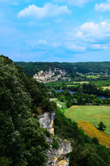 Fototapeta na wymiar View of the village of La Roque Gageac and the Dordogne River from the gardens of the Chateau de Marqueyssac near Vezac, France