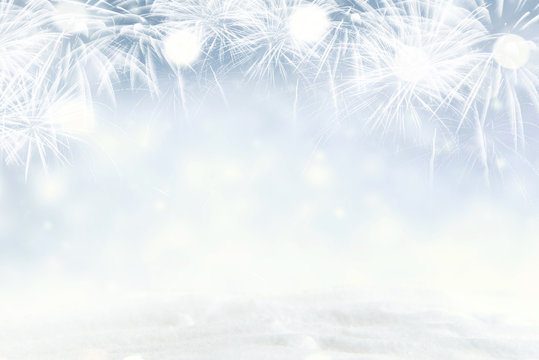 Winter Fireworks and bokeh with snowflake in New Year eve and copy space. Abstract background holiday.