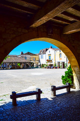 Architecture in the central square of the medieval bastide village of Monpazier in the Dordogne region of France