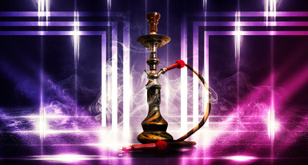 Purple, pink background of smoking hookah on the concrete floor, in clouds of smoke and neon light