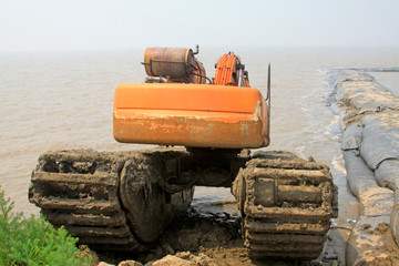 Large excavators in the seaside