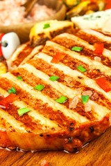 Grilled pork chop on a wooden board. Protein food. Grilled meat. Food preparation. Protein diet.