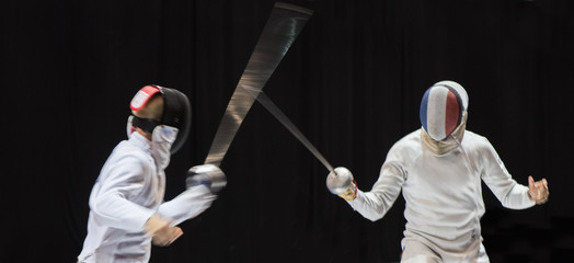 Two man fencing athletes fight