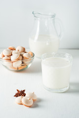 Glass of milk and cookie composition isolated over the white background