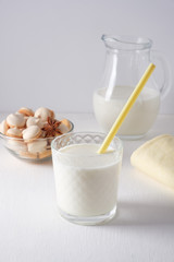 Glass of milk and cookie composition isolated over the white background