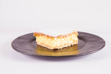 Napoleonka cake - a Polish type of cream pie - sprinkled with powdered sugar