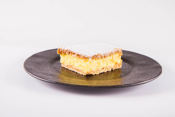 Napoleonka cake - a Polish type of cream pie - sprinkled with powdered sugar