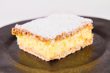 Napoleonka cake - a Polish type of cream pie - sprinkled with powdered sugar