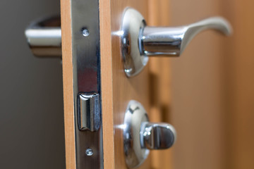 Door interroom headset metal handle and latch closeup