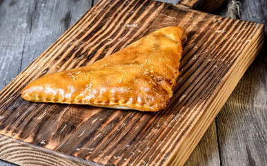 Traditional Georgian bread - khachapuri and Kolkh khachapuri on the wooden background.
