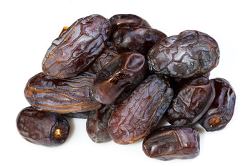 big ripe dates heap isolated on white background