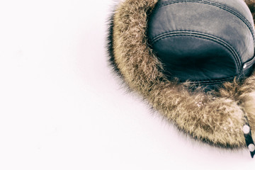 Fur hat for winter for men, on natural snow. there is toning and close-up