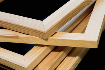 Wooden stretcher bars on black background.