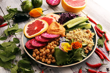 Bowl of Buddha, The concept of a healthy diet: chickpeas, salad, beetroot, pumpkin, cucumber, grapefruit, cabbage and tabouleh. Balanced food.
