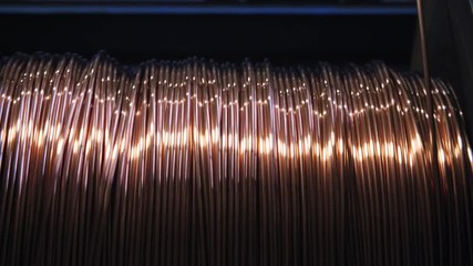 Closeup of Copper Cable being Rolled up in Preparation for Shipment at the Factory 4K - Powered by Adobe