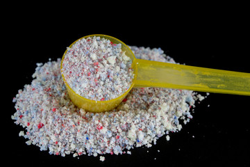 Powder and tablets for the dishwasher on the kitchen table. Cleaning agent for household dishwashers.