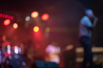 Defocused shot of singer on stage during performance