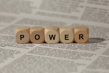 wooden cubes with letters. the word power is displayed, abstract illustration