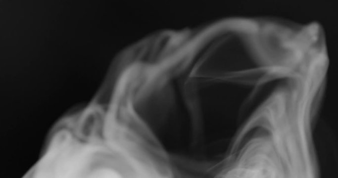 Smoke background. White smoke floating through space against black background	