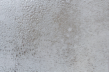 Rain drops on the window glass closeup