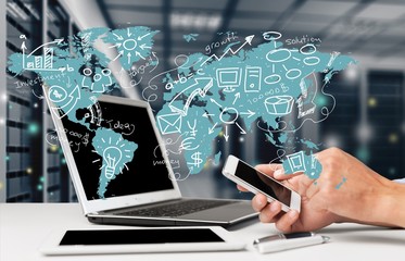 Business man hands using mobile and laptop