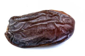 single big dates close-up with wrinkled skin surface