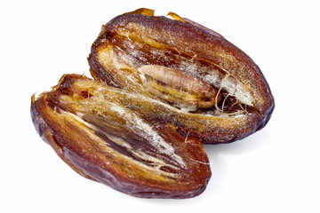 big ripe date - a piece cut in half dates, the core in the middle, isolated on white background