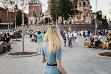 girl walks on the red square in Moscow near the Kremlin