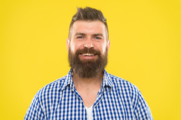 Bearded and happy. Man bearded rustic hipster stylish beard yellow background. Barber tips maintain...