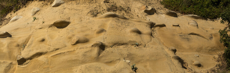 Sand formations in the mountains of the Black Sea coast. Fantastic landscape of extraterrestrial origin. The remains of ancient fairy-tale creatures. Natural sculptures made by wind and water.