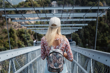  Skypark in Sochi, extreme summer jumping in the mountains. Tourist girl in skypark