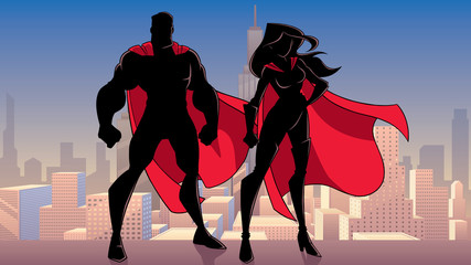 Illustration of silhouette superhero couple, standing tall on rooftop above city. © Malchev
