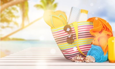 Bag,  flip flops on a tropical beach