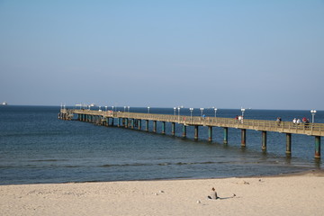 Fototapeta na wymiar Long wooden pier of Binz, Island Rügen at Baltic Sea in Germany