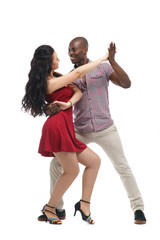 White girl and black man dancing samba isolated on white background.
