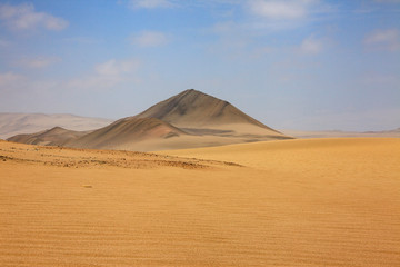 Fototapeta na wymiar The desert in Paracas in Peru. Yta sea and sand