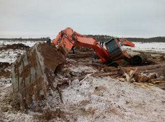 excavator drowned in the swamp in winter