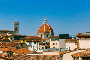 Fototapeta na wymiar Dome of Florence Cathedral over buildings in the historical center of Florence, Italy