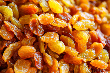 beautiful and useful yellow dried raisins close-up view from the top.