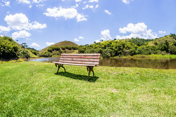 landscape, lawn with back hill and chair to the front isolated